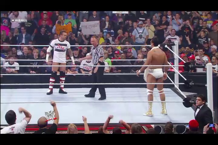A frame from WWE Raw (September 26, 2011) at 1:17:27. A WWE Raw match in progress features two wrestlers in the ring with a referee, while the crowd fills the arena stands. The WWEHD logo is visible in the corner as fans watch the action unfold near the ropes.