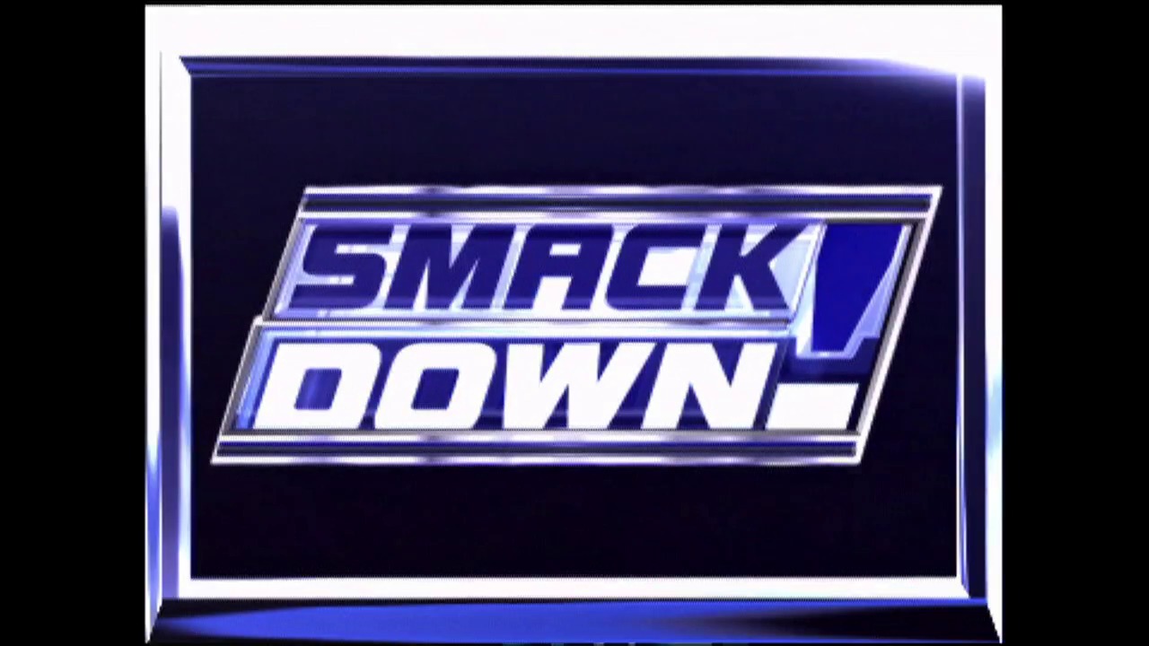 A frame from WWE Raw (April 18, 2002) at 0:25. The WWE SmackDown logo is displayed in a stylized metallic blue and silver design against a dark background, featuring the distinctive angled parallelogram shape characteristic of early 2000s WWE branding.