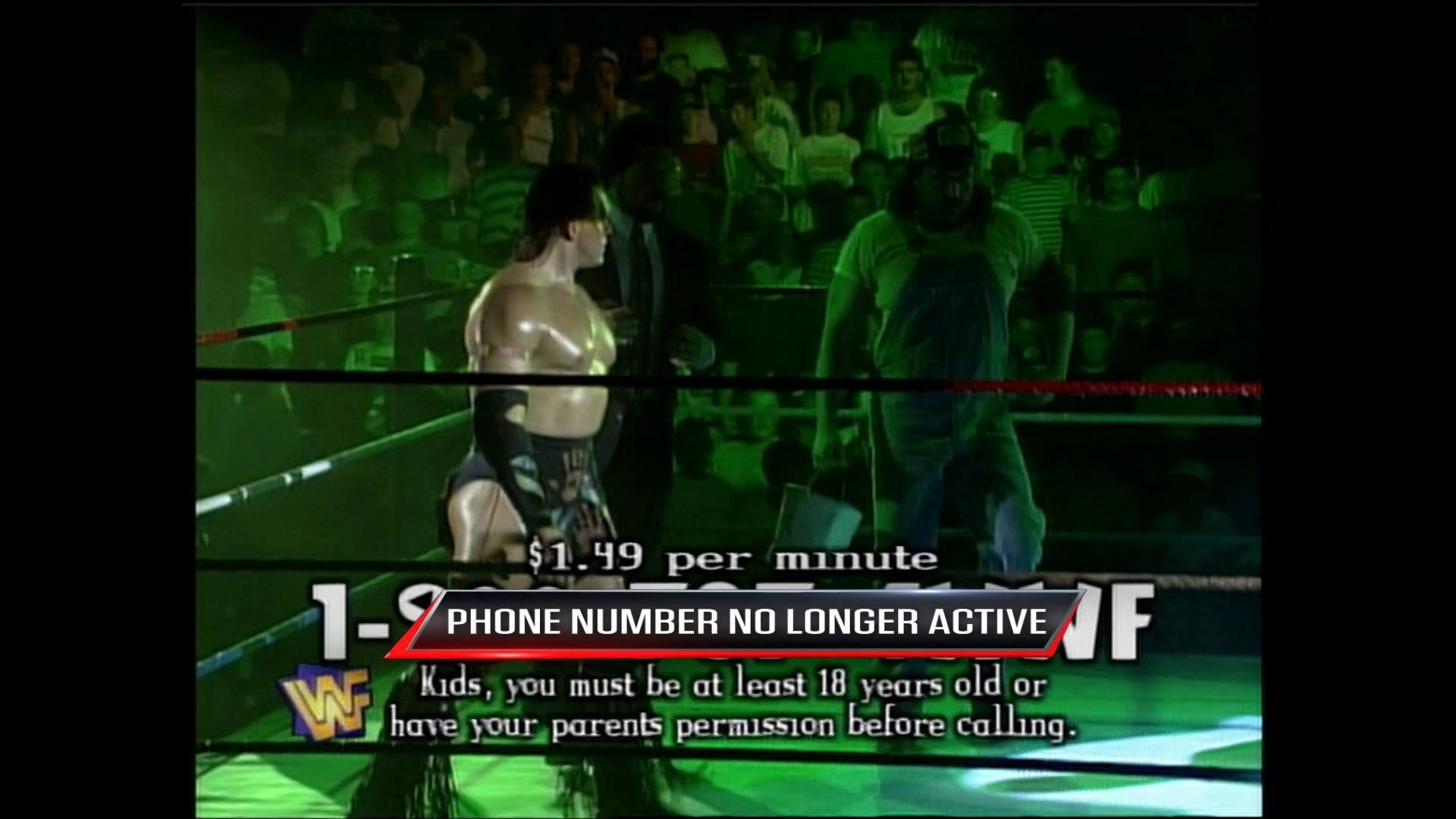 A frame from WWE Raw (July 10, 1995) at 36:30. A shirtless wrestler stands in a WWF wrestling ring surrounded by a green-tinted crowd. On-screen graphics display a phone number ($1.49 per minute) and a disclaimer stating "PHONE NUMBER NO LONGER ACTIVE" with age restrictions for calling.