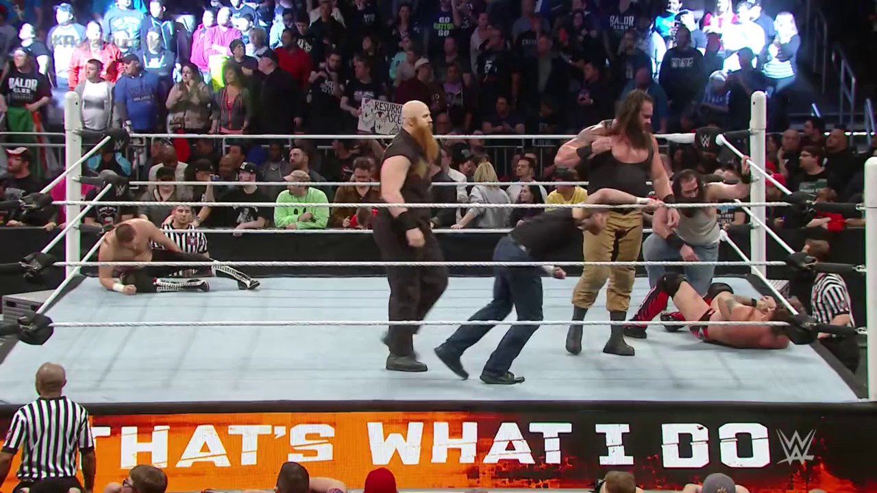 A frame from WWE Royal Rumble (2016) at 2:33:43. # WWE Royal Rumble 2016 Scene

A WWE wrestling match unfolds in the ring with multiple wrestlers engaged in action, while referees monitor the bout. The enthusiastic crowd fills the arena behind the ropes, and an orange banner reading "THAT'S WHAT I DO" displays at the ring's edge.