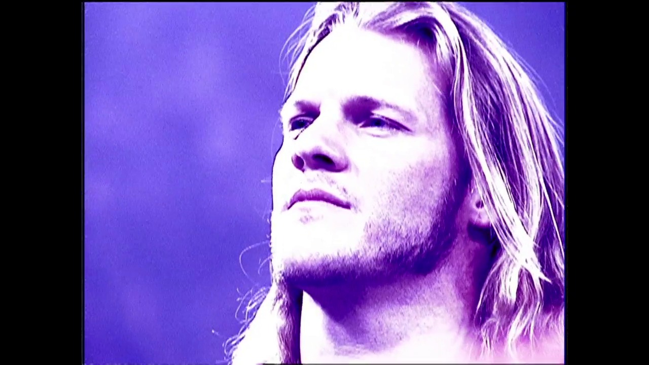 A frame from WWE SmackDown (November 1, 2001) at 0:37. # Visual Description

A wrestler with long blonde hair is shown in profile against a purple-tinted background, gazing upward with a contemplative expression during a WWE SmackDown broadcast from November 2001.