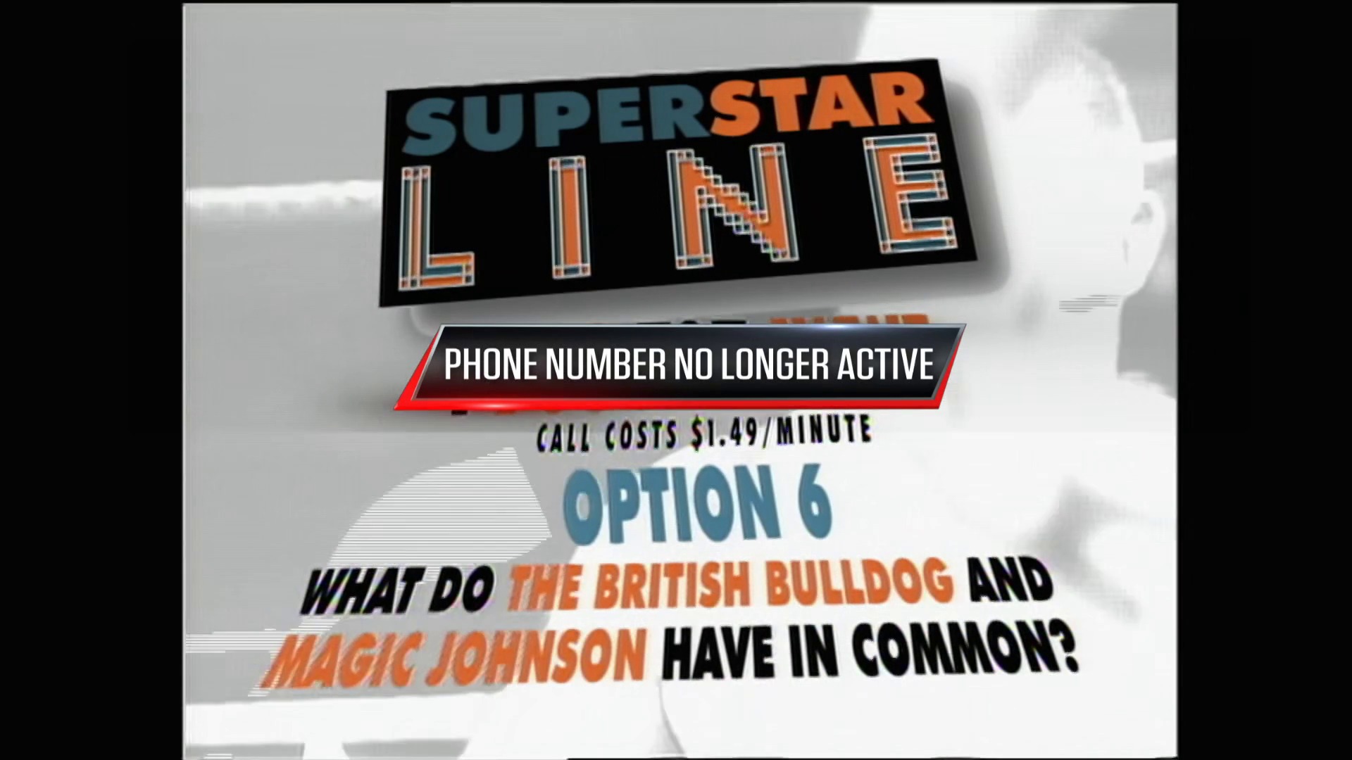 A frame from WWE Raw (April 15, 1996) at 40:47. # Visual Description

A WWE SuperStar Line graphic displays a trivia question asking what the British Bulldog and Magic Johnson have in common, with a notification that the associated phone number is no longer active and calls cost $1.49 per minute.