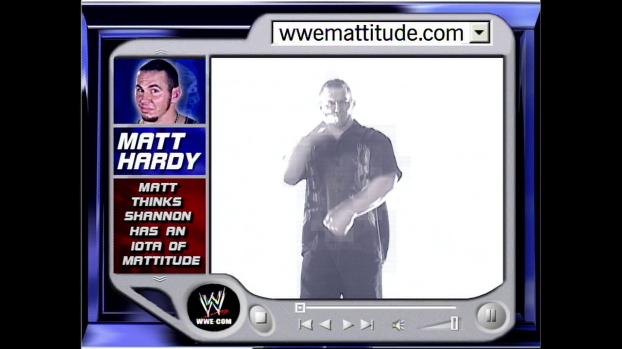 A frame from WWE SmackDown (January 30, 2003) at 24:22. A WWE SmackDown broadcast frame featuring Matt Hardy's profile card on the left with his photo and commentary text, while the main video screen displays a wrestler in dark clothing. The interface mimics early 2000s web design with the website URL "wwemattitude.com" at the top.