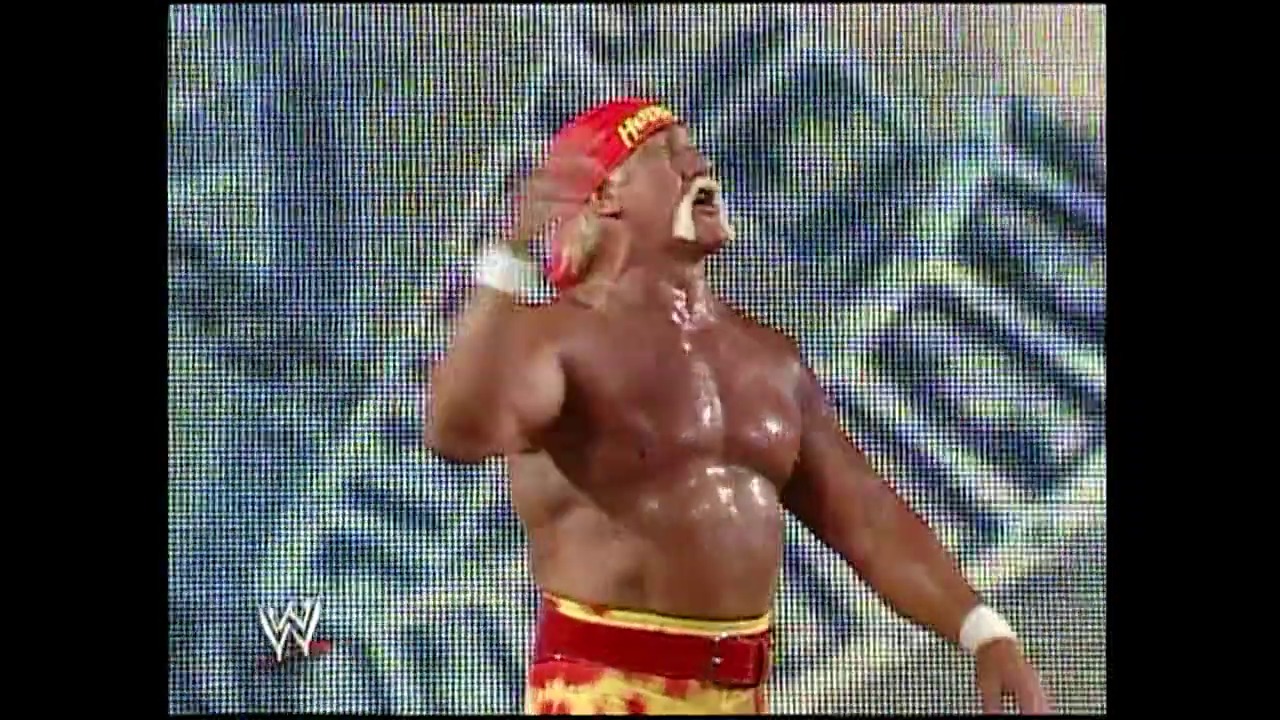 A frame from WWE Raw (April 4, 2005) at 40:58. A professional wrestler in red and gold attire with a red headband stands shirtless in the ring, displaying an animated expression. The WWE logo is visible in the lower left corner of the broadcast frame.
