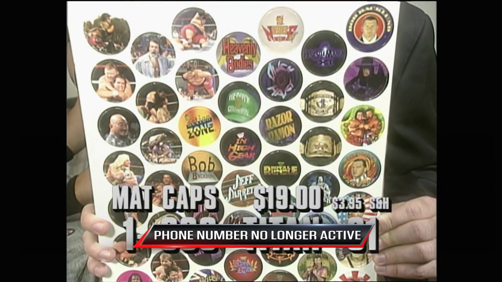 A frame from WWE Raw (August 14, 1995) at 34:26. A wrestling merchandise advertisement displays colorful mat caps featuring wrestlers and WWF logos, priced at $19.00 with a sale price of $3.95-$8.00. An overlay states "PHONE NUMBER NO LONGER ACTIVE" at the bottom of the promotional graphic.