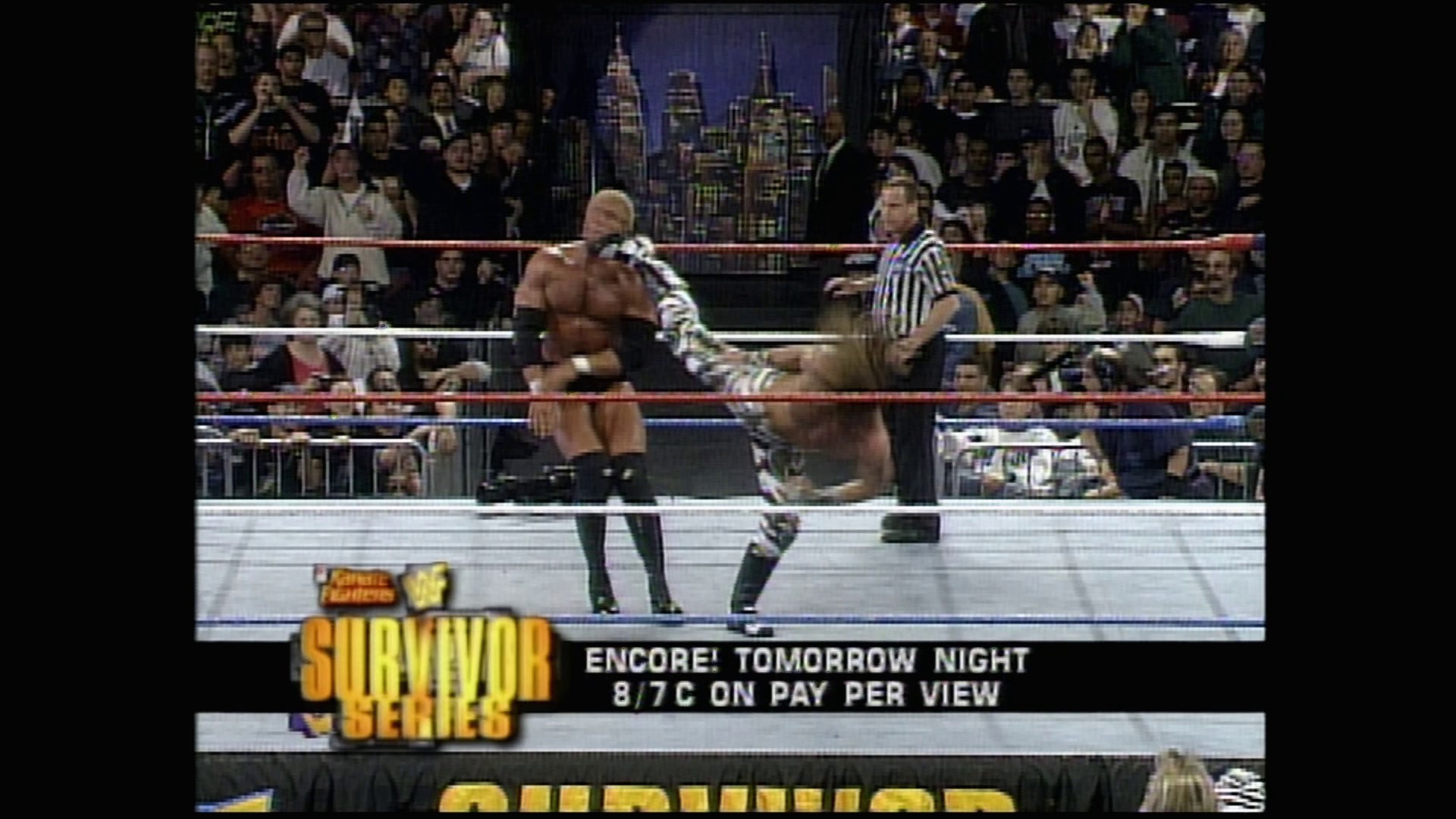 A frame from WWE Raw (November 18, 1996) at 33:06. # WWE Raw (November 18, 1996)

Two wrestlers face off in the ring during an intense match, with a referee present and a packed crowd visible in the background. The broadcast displays the "Survivor Series" logo and promotional text for "Encore! Tomorrow Night 8/7C on Pay Per View" at the bottom of the screen.